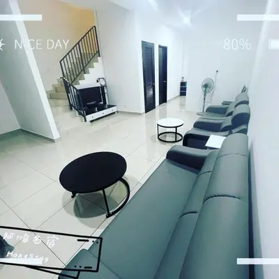 a waiting room with blue chairs and a table at HongStay SUNGAI BESAR in Sungai Besar