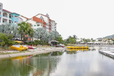 a body of water with yellow boats in it at Marina Island Lumut 3 Bedroom Holiday Apartment in Lumut