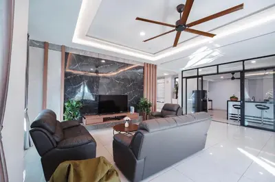 a living room with a couch and a tv at 22 Penthouse by BRB, Airport View & 18 Pax in Bayan Lepas