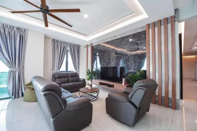 a living room with leather furniture and a flat screen tv at 22 Penthouse by BRB, Airport View & 18 Pax in Bayan Lepas