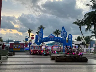 a train in front of a amusement park at IRONMAN HomeStay in Lumut