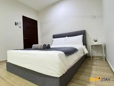 a bedroom with a large bed in a room at Taiping City Centre Landed Corner Lot for 12 Pax in Taiping
