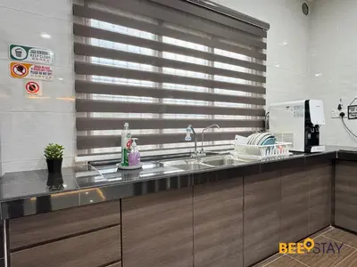 a kitchen with a sink and a window at Taiping City Centre Landed Corner Lot for 12 Pax in Taiping