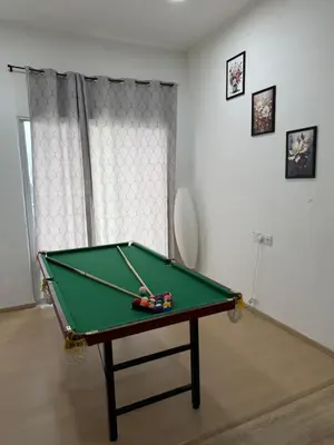 a room with a pool table in a room at AYAAN ATRIUM Homestay with PS4 GAMING and Snookers in Tanah Rata