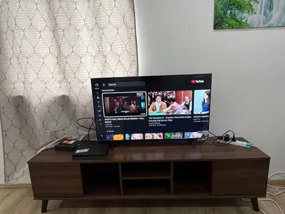 a computer monitor sitting on top of a wooden table at AYAAN ATRIUM Homestay with PS4 GAMING and Snookers in Tanah Rata