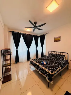 a bedroom with a bed and a ceiling fan at KoopJiha Homestay Meru Ipoh in Ipoh