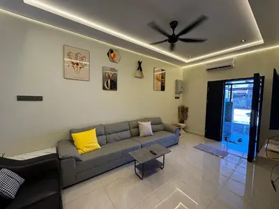 a living room with a couch and a ceiling fan at New PRMO !!! Ipoh Staycation Homefeel 50