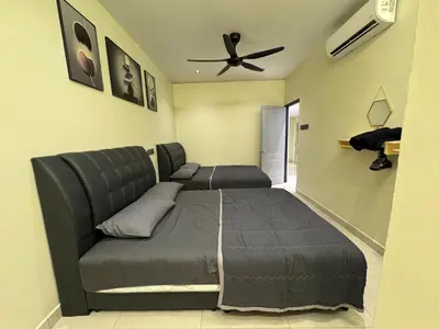 a bedroom with a bed and a ceiling fan at New PRMO !!! Ipoh Staycation Homefeel 50