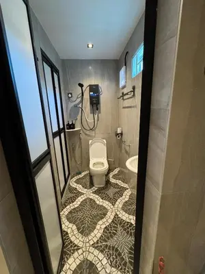 a bathroom with a toilet and a sink at New PRMO !!! Ipoh Staycation Homefeel 50