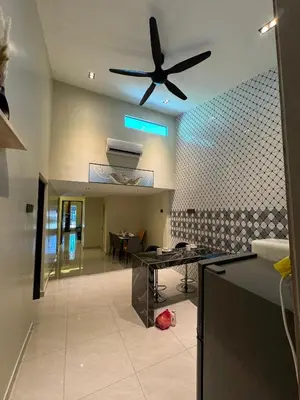 a kitchen with a ceiling fan and a table at New PRMO !!! Ipoh Staycation Homefeel 50