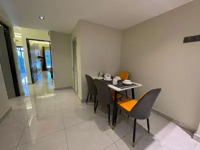 a dining room with a table and chairs at New PRMO !!! Ipoh Staycation Homefeel 50