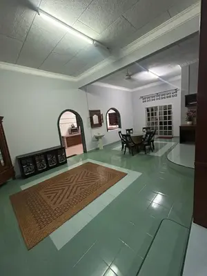 a large living room with a table and chairs at Homestay Laman Kasih Mama in Seri Manjung