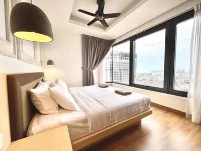 a bedroom with a bed and a ceiling fan at French Vintage Luxury 2BR Suites at Georgetown in George Town