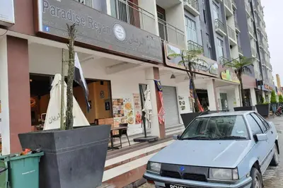 a car parked in front of a building at Barrington Square Apartment Pasar Malam in Brinchang