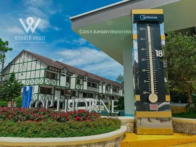 a sign in front of a building with a hotel at Cozy Highlands Escape at Copthorne Cameron Highlands in Tanah Rata