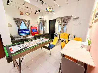 a room with a pool table and a living room at CozyKota8Pax 4MinsToJonker in Gua Sai