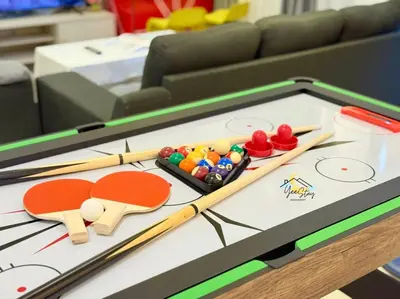a table with ping pong balls and chopsticks on it at CozyKota8Pax 4MinsToJonker in Gua Sai