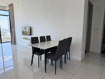 a table and chairs in a room with a window at Beacon Executive Suites with Infinity Pool by BNB4U in George Town
