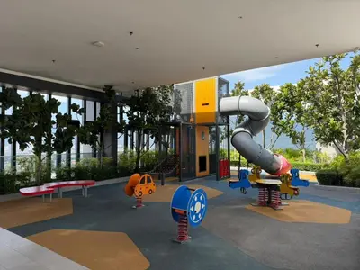 a playground with a slide in a building at Beacon Executive Suites with Infinity Pool by BNB4U in George Town
