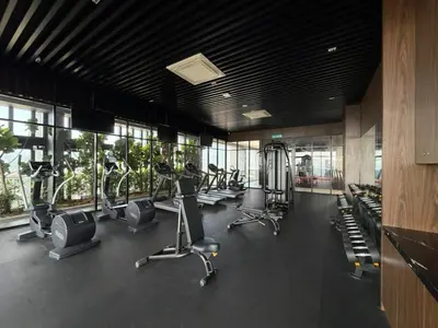 a gym with treadmills and ellipticals in a building at Beacon Executive Suites with Infinity Pool by BNB4U in George Town
