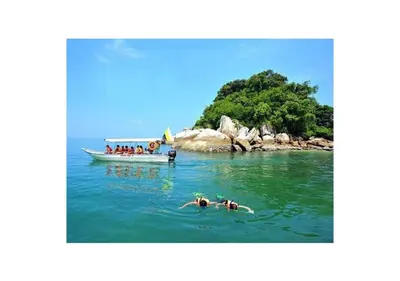 a group of people in the water next to a boat at Pangkor Villa Jia Yuan \u90a6\u54af\u5c9b\u5bb6\u82d1\u6d77\u6ee9\u522b\u5885 in Pangkor