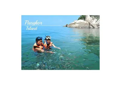 two people in the water in the ocean at Pangkor Villa Jia Yuan \u90a6\u54af\u5c9b\u5bb6\u82d1\u6d77\u6ee9\u522b\u5885 in Pangkor