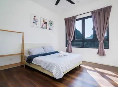 a bedroom with a bed and a large window at 2Br Sunway Onsen Suit 5 Pax in Tambun