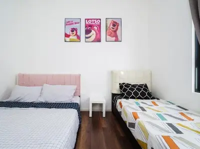 two beds sitting next to each other in a room at 2Br Sunway Onsen Suit 5 Pax in Tambun