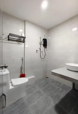 a bathroom with a toilet and a sink at Grace Homestay Taiping in Taiping