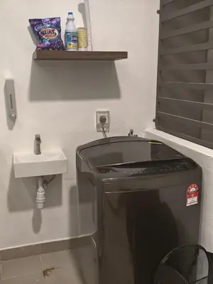a small bathroom with a sink and a toilet at Domuss Guesthouse- 4B3B Tunas in Bayan Lepas