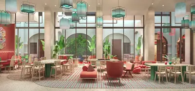 a lobby with tables and chairs in a building at Capri by Fraser, Penang in George Town
