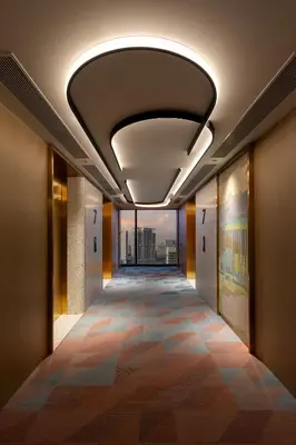 a hallway in a building with a ceiling with a view at Capri by Fraser, Penang in George Town