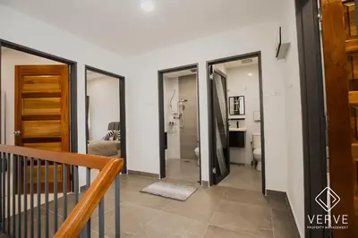 a hallway with sliding glass doors in a house at Ipoh Yistay by Verve 10 Pax 4B4B in Ipoh