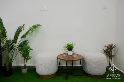 a room with three chairs and a table with plants at Ipoh Yistay by Verve 10 Pax 4B4B in Ipoh