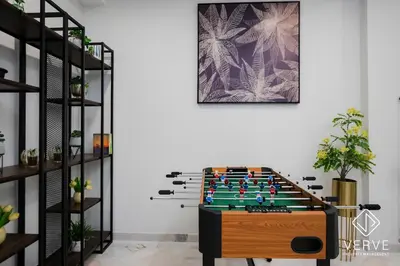 a foosball table in the middle of a room at Ipoh Yistay by Verve 10 Pax 4B4B in Ipoh