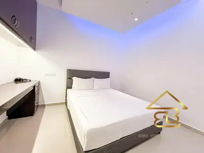 a white bedroom with a bed and a desk at 7BR Huge House, 6 Bathroom, 20Pax, 10 min to IpohCity in Ipoh