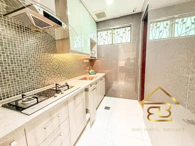 a kitchen with a sink and a stove top oven at 7BR Huge House, 6 Bathroom, 20Pax, 10 min to IpohCity in Ipoh