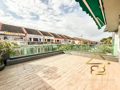 a balcony with a wooden floor and a building at 7BR Huge House, 6 Bathroom, 20Pax, 10 min to IpohCity in Ipoh