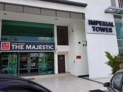 an imperial tower building with a sign in front of it at Homii Ipoh CBD in Ipoh