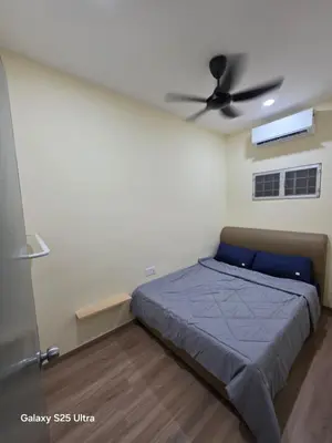 a bedroom with a bed and a ceiling fan at Bliss Homestay in Simpang Ampat