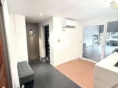 a view from the living room into the kitchen and dining room at Gather lnn in George Town