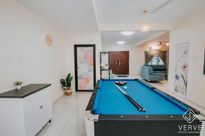 a pool table in the middle of a living room at Ipoh Midtown 66 Playhouse by Verve in Gua Sai