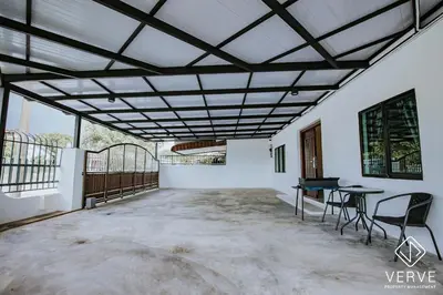 a patio with a table and chairs in a building at Ipoh Midtown 66 Playhouse by Verve in Gua Sai
