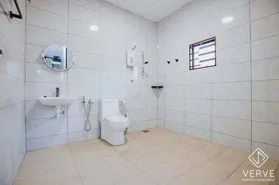 a white bathroom with a toilet and a sink at Ipoh Midtown 66 Playhouse by Verve in Gua Sai