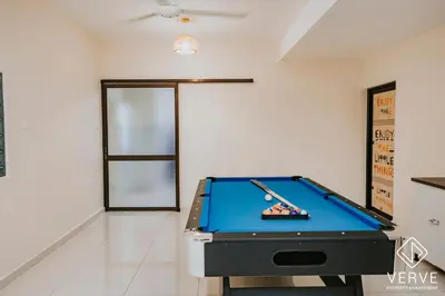 a room with a pool table in a room with a ceiling at Ipoh Midtown 66 Playhouse by Verve in Gua Sai