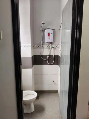a bathroom with a toilet and a shower at Ian's homestay II tanahrata chighlands in Tanah Rata