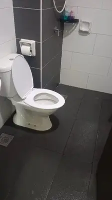 a bathroom with a white toilet in a stall at Skyhauz Ipoh Cityview 2BR Homestay in Ipoh