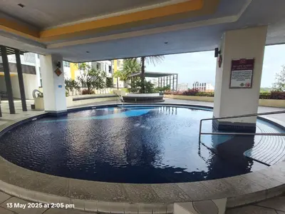 a swimming pool in the middle of a building at Skyhauz Ipoh Cityview 2BR Homestay in Ipoh