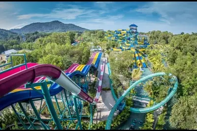 a roller coaster at a theme park at By the sea Beach Front, Seaview And Pool side in Batu Ferringhi