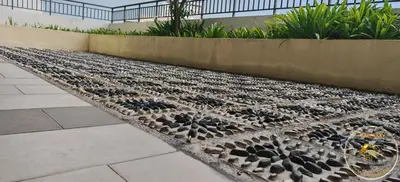 a pile of rocks on the side of a sidewalk at Heart of Town Free WIFI -Majestic Ipoh By Hopestay in Ipoh